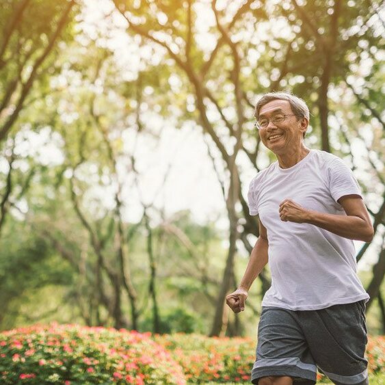 Senior mature man jogging In Park
